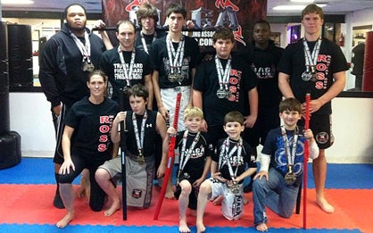 Pictured are members of the Ross Martial Arts Fight Team who competed (from left to right): Front row - Ronda Russell, Brett Schroeder, Jay Bell, Cameron Bell, and Collin Morgan; Back row - Tony Nicholson, Jay Russell, Jackson Morrison, Tristen Fitz-Gerald, Hunter Compton, Terrell Johnson, and Lane Hawkins. 