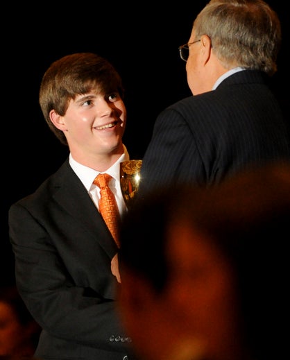 Sweet Water's Brett Davis accepts his scholar athlete award from AHSAA State Director Steve Savarese. (Photo by al.com).