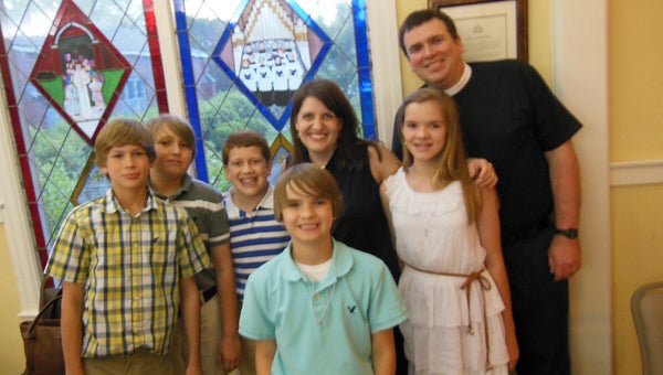 Some of the younger members confirmed Wednesday into Trinity Episcopal Church with the Rev. John David Barnes and Amanda Barnes.