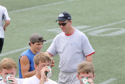Logan McVay, freshman quarterback at DHS, received instruction from Peyton Manning during the Manning Passing Academy.