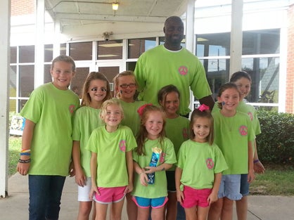 Westside Elementary School principal Tony Pittman showed his support of Harrison with some students.