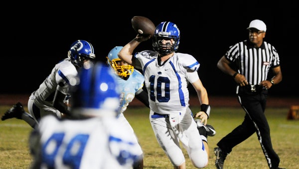 Demopolis quarterback Tyler Oates throws a pass Friday against the Selma Saints. The Tigers won the game 35-12.