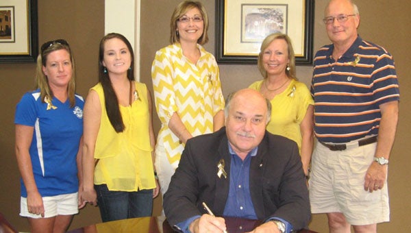 Demopolis Mayor Mike Grayson signed a proclamation Tuesaday making September Childhood Cancer Awareness Month in Demopolis. Shown are Amy Dotson, Katelyn Beshears, Jennifer Thomason, Debbie Butler and Gary Butler. 