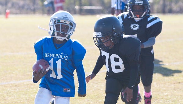 Christopher Baitey runs for the Demopolis 7/8 year olds. The Rookies fell to Greensboro 7-6.
