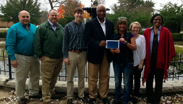 Georgia-Pacific's Naheola mill donated $2,500 to the Demopolis Area Chamber of Commerce for Christmas on the River. Shown are Demopolis Mayor Mike Grayson, John Scales, Chamber Director Michael Kennedy, G-P Naheola Mill VP Kelvin Hill, Buffy Etheridge, Mallie Quarles and Aretha Muhammed.