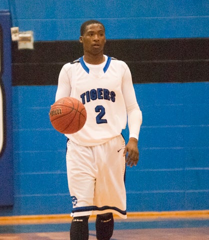 Roderick Davis brings the ball up the court for the Tigers.