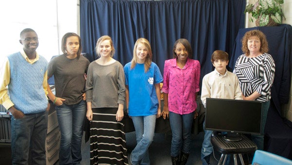 Demopolis Middle School's broadcast journalism class produced their first show Tuesday morning. Shown are members of the class, from left, Tyler Ward, Keyjana Waller, Sidney Alyn Atkins, Hope Vann, Cheyenna Brown, Kase Adams and instructor Ginger Godwin.
