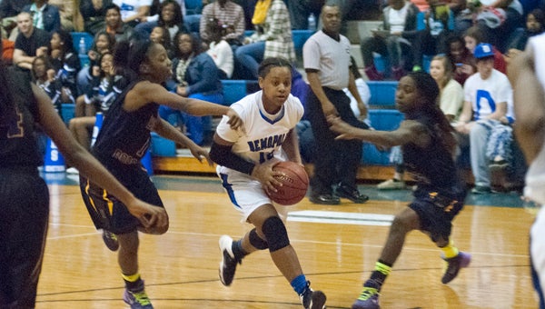 Sha'Deitra White drives into the lane to the basket for Demopolis on Friday against R.C. Hatch.