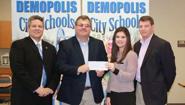Trustmark Bank made a donation to the DHS National Academy Foundation of Finance and Insurance for a scholarship. Shown are Demopolis City Schools Superintendent Dr. Al Griffin, Valley Harrison with Trustmark, DHS academy director Kelly Gandy and DHS principal Dr. Tony Speegle.