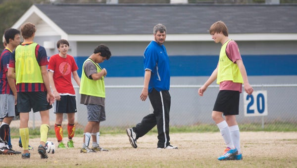 DHS head soccer coach Brad Daniels gives instruction during a practice Tuesday afternoon.