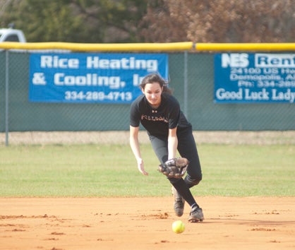 Anna Caroline Logan fields a ball during practice.