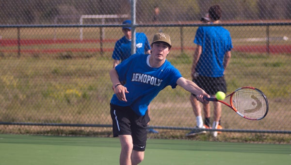 Jacob Browder lunges to return a hit in Demopolis' match against Sipsey Valley on Monday. Browder won his singles match 8-5.