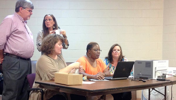 From left, Marengo County Circuit Clerk Kenny Freeman, Jenny Houlditch, Marengo County Probate Judge Laurie Hall, Ann Hunter and Paula McDaniel work to make sure all votes were tallied properly from Tuesday's election.