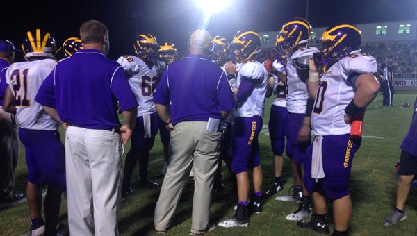 Sweet Water head coach Pat Thompson talks to his players during a timeout in Friday’s game against Thomasville.