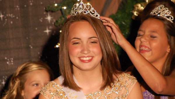 SueEllen Marie Broussard of Greensboro, Ala., is crowned Junior Miss Christmas on the River Monday night. (Times Staff/Andy Brown)