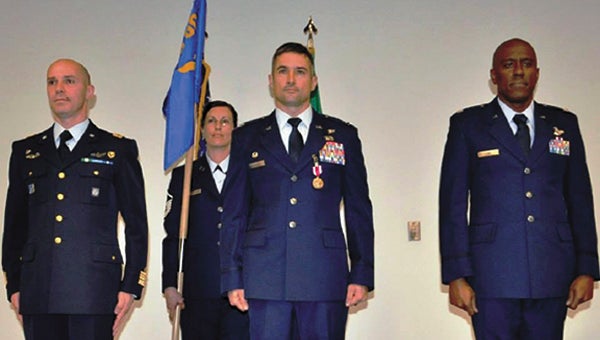 Lt. Col. T.J. Lowe (right) officially became commander of the 80th Operations Support Squadron in a Jan. 23 ceremony with 80th Operations Group commander Col. Paolo Baldasso (left) and outgoing 80th OSS commander Lt. Col. Anthony Mulhare (center) at Sheppard Air Force Base in Texas. Jan. 23, 2015.  (Debi Smith | USAF Photo)