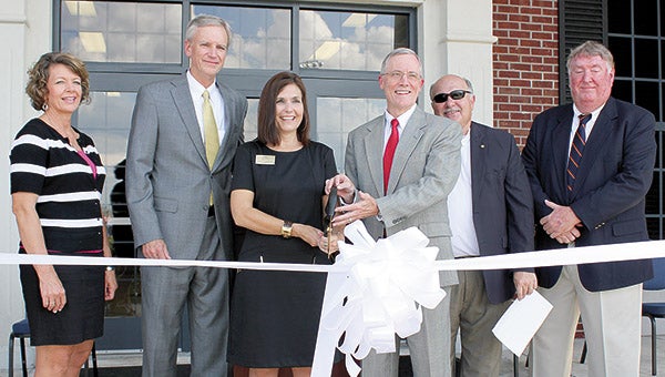 A special ribbon cutting was held Tuesday celebrating the grand re-opening of the Demopolis Higher Education Center that will be operated by Shelton State Community College. Pictured are, from left, Diane Brooker of the Marengo County Industrial Development Board; SSCC Chancellor Dr. Mark Heinrich; SSCC President Dr. Andrea Mayfield; UWA President Dr. Ken Tucker; Demopolis Mayor Mike Grayson; and Chuck Smith, member of the Alabama Community College Board of Directors.