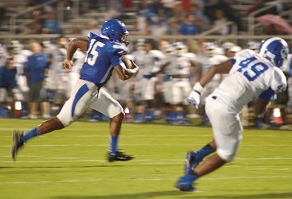 Starting Quarterback Jamarcus Ezell carries the ball on his way to the pylon for a touchdown. Ezell finished with two touchdowns on the ground.