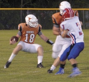 Marengo Academy’s Hayden Huckabee looks to avoid the South Choctaw Academy defense Thursday night. Huckabee was among the many bright spots for the Longhorns, rushing for 125 yards in the victory.
