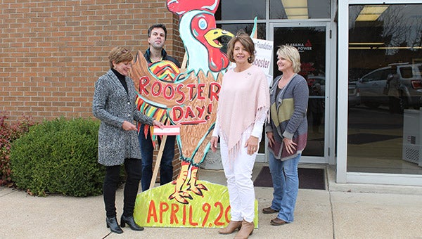 From left, Lisa Compton, chairman; Kirk Brooker, curator of the Marengo County Historical Society; Diane Brooker, chair of the auction, and Shelley Wood, chair of the Rooster Fair in Public Square. With the check that Diane is presenting to Lisa, the Alabama Power Foundation becomes a Rooster Booster.