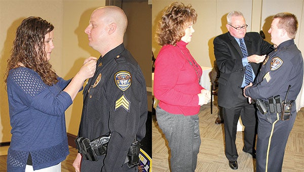 LEFT: Nicole Reeves places a sergeant’s pin on the uniform of her husband, Cody Reeves. RIGHT: Stan Reeves, along with Jody Allen, places a sergeant’s pin on the uniform of their son, Darryl Reeves. The promotion ceremony held Monday, Feb. 8, at the Demopolis Police Department.