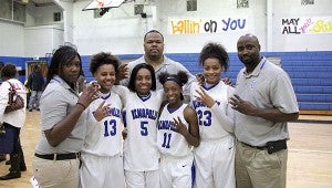 Dee Dee White, Courtney Hill, Erica Bennett and Ivery Moore celebrate their final home game at DHS alongside coaches Gabrielle Essex, Ronnie Abrams and Tony Pittman. 