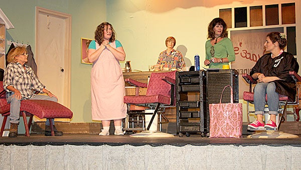 The Canebrake Players will present “Steel Magnolias” at the Canebrake Theatre this weekend. Pictured above during a recent rehearsal are, from left, Ann Parsons as Ouiser, Kelley Freeman Mullins as Annell, Laurie Willingham as Clairee, Deborah Griffith as Truvy, and Andi Turberville as Shelby. The cast also includes Donna Bishop as M’Lynn. Susanna Naisbett is directing.