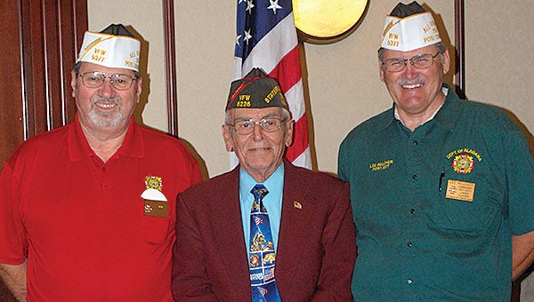 VFW Department Commander Walt Dempster presents Post Quartermaster Luther Massey and Post Commander Lee Belcher. The white caps are distinctive headgear worn by the All State Team.