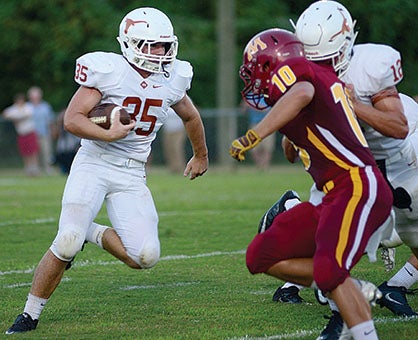 Weldon Aydelott looks for room to run in Marengo Academy’s 42-6 victory over Morgan Academy. Aydelott scored three touchdowns and led all rushers with 161 yards.