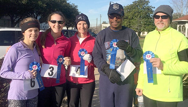 After being postponed for severe weather, Sav-A-Life held its Walk/Run 4 Life 10K on Jan. 28. Winners in the different age groups of the event are, from left, Lauren Boone, Beth Mason, Monica Cox, Barrown Lankster, and Randy Fowler.
