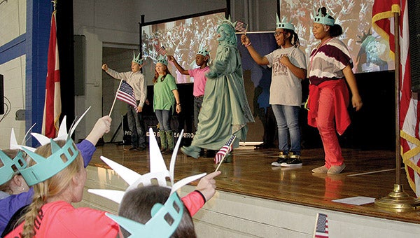 Students at U.S. Jones Elementary School join “Libby Liberty” in the singing of “YOU in the U.S.A.” to kick off this year’s Liberty Learning Foundation’s Super Citizen program. A similar event was held at Westside Elementary School where second graders will be participating in the program.